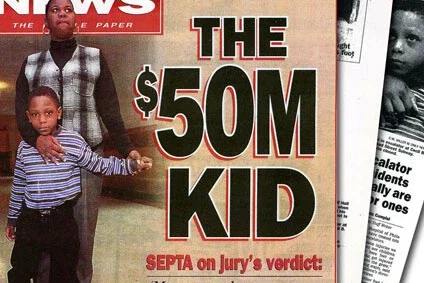 Newspaper front page headline announcing $50 million jury verdict for child in personal injury lawsuit