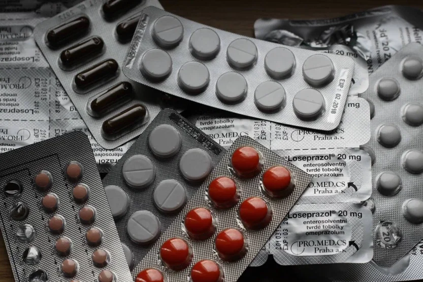 Multiple blister packs of prescription medications representing dangerous drug and pharmaceutical liability cases