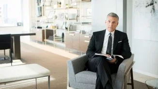 Joel Feller, Philadelphia medical malpractice attorney, seated in modern law office with case file