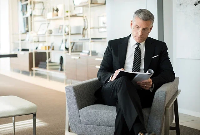 Founding partner, Joel Feller, sitting in his office and reading a document