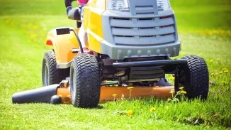 Riding lawn mower operating close to ground representing defective equipment personal injury claim