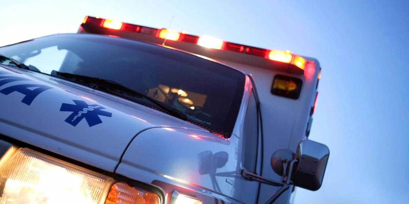 Ambulance with flashing emergency lights representing personal injury and emergency medical response after an accident
