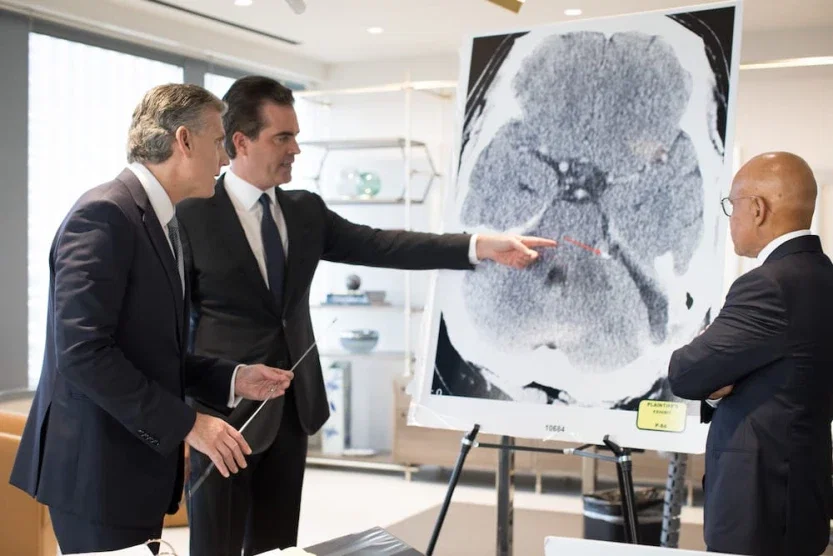 Philadelphia medical malpractice attorneys reviewing brain scan exhibit together in preparation for trial