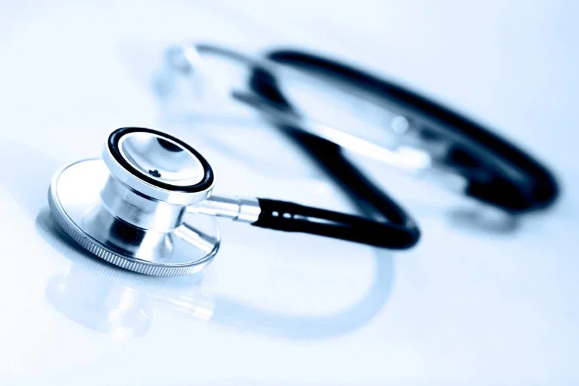 Medical stethoscope on reflective surface representing healthcare negligence and medical malpractice injury claims