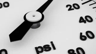 Industrial PSI pressure gauge dial representing equipment malfunction and product liability injury claims