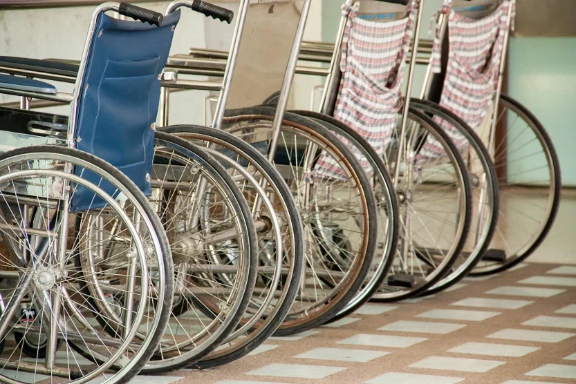 Row of wheelchairs in hospital corridor representing serious injury cases resulting in permanent disability