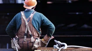 Construction worker in hard hat on job site representing workplace accident and personal injury claims